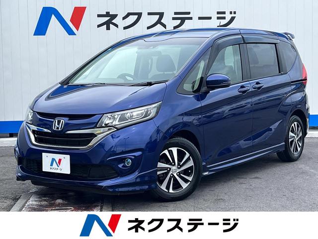 沖縄県豊見城市の中古車ならフリード Ｇ・ホンダセンシング　両側電動スライドドア　ホンダセンシング　純正ＳＤナビ　レーダークルーズ　バックカメラ　Ｂｌｕｅｔｏｏｔｈ　フルセグ　ハーフレザーシート　ＬＥＤヘッドライト　６人乗り　車線逸脱警報　革巻きステアリング