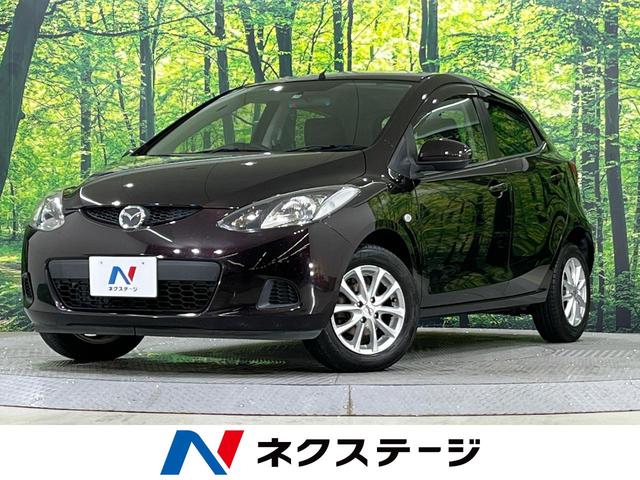 マツダ １３Ｃスマートエディション　禁煙車　純正ナビ　デジタルＴＶ　ＥＣＴ　ＣＤ　トラクションコントロール　シートリフター　電格ミラー　ＡＢＳ　１４インチＡＷ　ヘッドライトレベライザー　キーレス