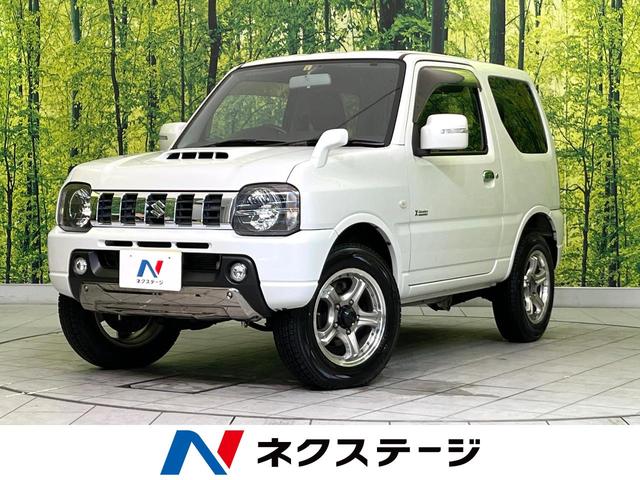 スズキ ジムニー クロスアドベンチャー　禁煙車　ターボ　４ＷＤ　ＳＤナビ　Ｂｌｕｅｔｏｏｔｈ再生　ＥＴＣ　シートヒーター　キーレス　センターデフロック　ＤＶＤ再生　プライバシーガラス　電動格納ミラー