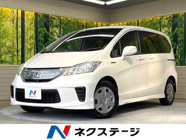 フリードハイブリッド(ホンダ) ジャストセレクション　両側パワースライドドア　禁煙車　純正ナビ　クルコン　スマートキー　オートエアコン 中古車画像