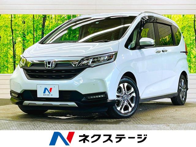 ホンダ フリード クロスター・ホンダセンシング　Ｃパッケージ　禁煙車　６人　インターナビセット　後席モニター　バックモニター　両側電動スライドドア　純正オプションＬＥＤヘッド　ＡｐｐｌｅＣａｒＰｌａｙ　アダプティブクルーズ　前後ドラレコ　ＥＴＣ