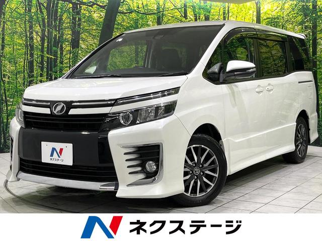 ヴォクシー(トヨタ) ＺＳ　ＢＩＧ−Ｘ９型ナビ　フリップダウンモニター　衝突軽減装置　禁煙車　電動スライドドア　Ｂｌｕｅｔｏｏｔｈ再生 中古車画像