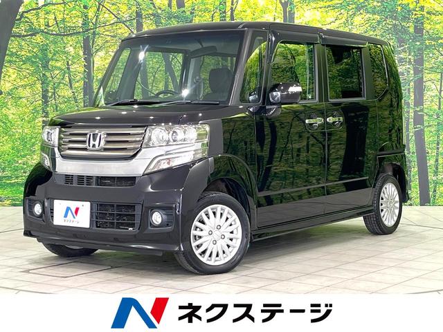 Ｎ－ＢＯＸカスタム Ｇ・Ｌパッケージ　４ＷＤ　フリップダウンモニター　純正ナビ　電動スライドドア　ＨＩＤヘッドライト　フルセグ　Ｂｌｕｅｔｏｏｔｈ再生　スマートキー　バックカメラ　横滑り防止装置　アイドリングストップ　オートライト（1枚目）