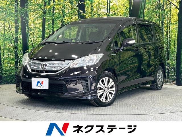 ホンダ ジャストセレクション　禁煙車　純正ナビ　後席モニター　両側電動スライドドア　スマートキー　クルーズコントロール　ＨＩＤヘッドランプ　オートエアコン　Ｂｌｕｅｔｏｏｔｈ再生　ＥＴＣ　７人乗り　オートライト