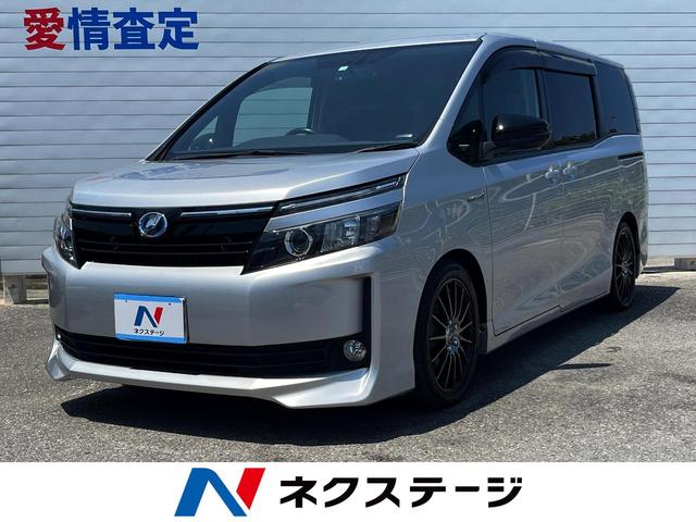 沖縄県の中古車ならヴォクシー ハイブリッドＶ　両側電動スライドドア　純正９インチナビ　バックモニター　フルセグ　Ｂｌｕｅｔｏｏｔｈ再生　フリップダウンモニター　ＥＴＣ　クルーズコントロール　ＬＥＤヘッドライト　シートヒーター　ドライブレコーダー