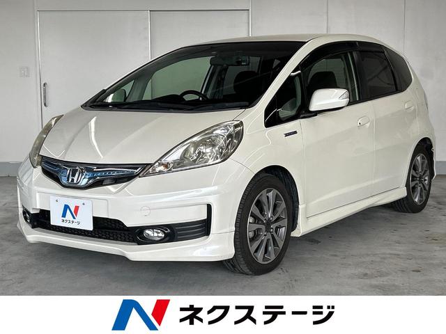 沖縄県の中古車ならフィットハイブリッド ＲＳ　ＳＤナビ　バックカメラ　ＥＴＣ　スマートキー　ＨＩＤヘッドライト　クルーズコントロール　オートライト　革巻きステアリング　オートエアコン　１６インチアルミホイール　フォグライト　ＣＤ再生　ＤＶＤ再生