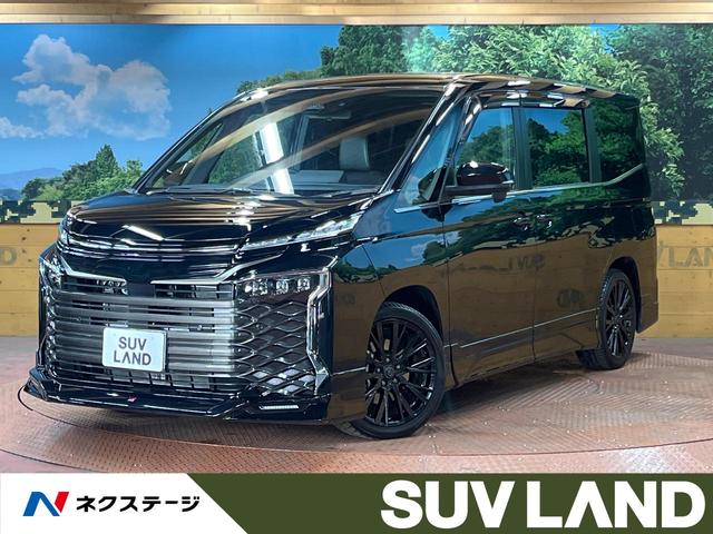 トヨタ ヴォクシー ハイブリッドＳ－Ｚ　禁煙車　ＧＲエアロ　１０型ナビ　フルセグＴＶ　バックカメラ　後席モニター　１００Ｖ電源　両側パワスラ　ＬＥＤヘッド　ハーフレザーシート　シートヒーター　セーフティセンス　レーダークルーズ　ＥＴＣ