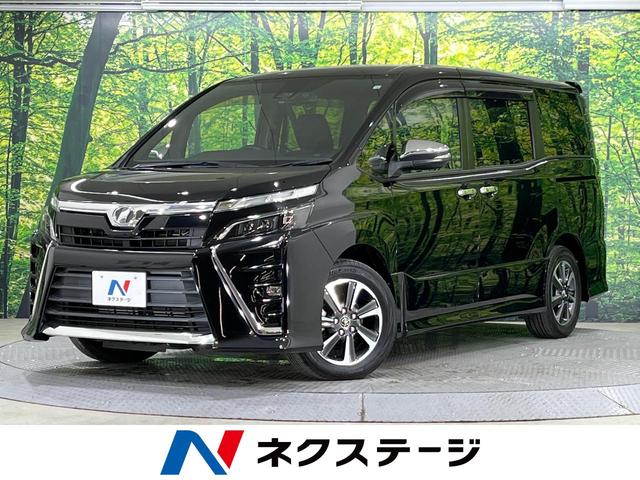 ヴォクシー ＺＳ　煌　禁煙車　１０インチナビ　フリップダウンモニター　両側電動スライドドア　トヨタセーフティ　クルーズコントロール　レーンアシスト　オートハイビーム　ＬＥＤライト　１６インチＡＷ　ＥＴＣ２．０　ＣＤ／ＤＶＤ（1枚目）