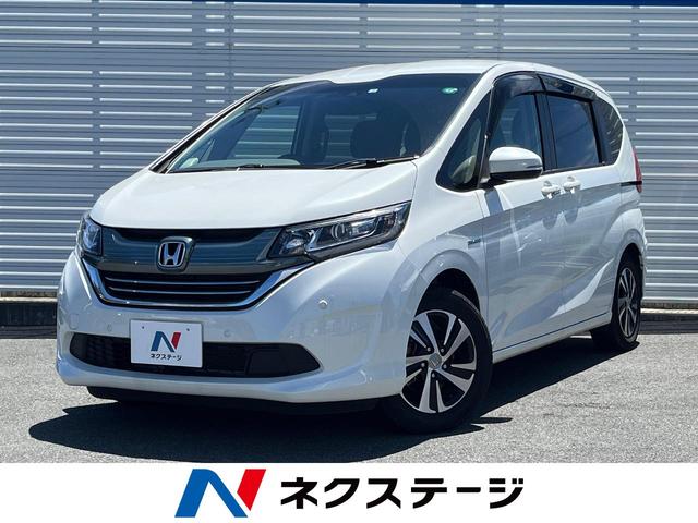 フリードハイブリッド(ホンダ) ハイブリッド・ＥＸ　ホンダセンシング　禁煙車　純正ナビ　Ｂｌｕｅｔｏｏｔｈ接続　バックカメラ　ＬＥＤヘッドライト 中古車画像