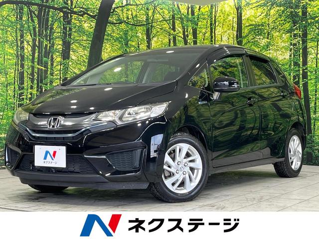 フィットハイブリッド(ホンダ) Ｆパッケージ　禁煙車　ＳＤナビ　バックカメラ　Ｂｌｕｅｔｏｏｔｈ再生　ＣＤ再生　ＤＶＤ再生 中古車画像