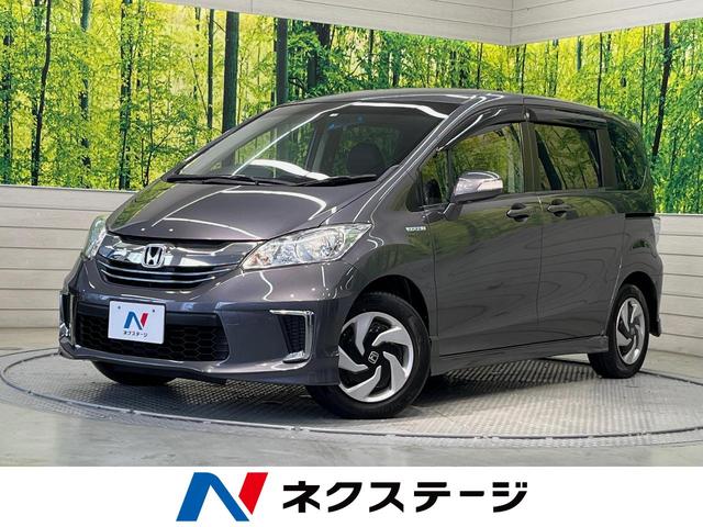 ハイブリッド　プレミアムエディション　純正フリップダウンモニター　純正ナビ　両側パワースライドドア　禁煙車　バックカメラ　ＨＩＤヘッドライト　クルーズコントロール　合皮コンビシート　ＥＴＣ　スマートキー　オートエアコン