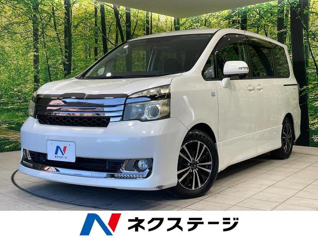 ヴォクシー(トヨタ) Ｚ　Ｇ’ｓ　電動スライドドア　純正ＳＤナビ　バックカメラ　禁煙車　スマートキー　ＨＩＤヘッド　ビルトインＥＴＣ　オートライト　デュアルエアコン　リアエアコン　Ｂｌｕｅｔｏｏｔｈ　ＣＤ　ＤＶＤ再生　フルセグ 中古車画像