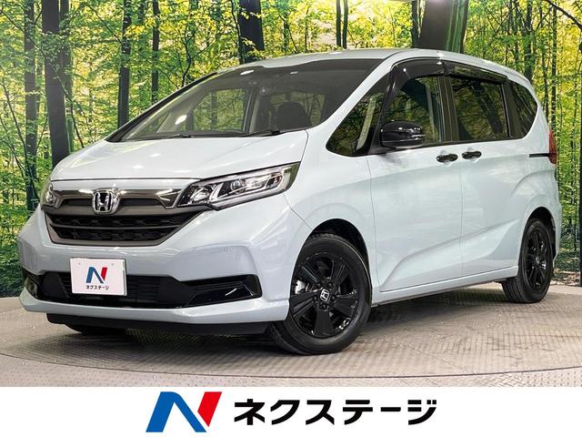 フリードハイブリッド(ホンダ) ハイブリッド・Ｇブラックスタイル　禁煙車　両側電動ドア　純正ＳＤナビ　バックカメラ　衝突被害軽減システム　ドラレコ　コーナーセンサー　スマートキー　ＬＥＤヘッド　ビルトインＥＴＣ　クルコン　車線逸脱警報　オートライト　オートエアコン 中古車画像