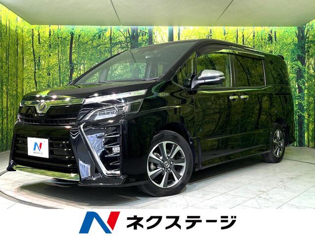 ヴォクシー(トヨタ) ＺＳ　煌ＩＩ　衝突軽減　純正１０型ナビ　両側電動スライド　後席モニター　ＬＥＤヘッドライト　Ｂｌｕｅｔｏｏｔｈ接続　フルセグ　バックカメラ　ＥＴＣ２．０　ドラレコ　ＣＤ／ＤＶＤ再生　ダブルオートエアコン 中古車画像