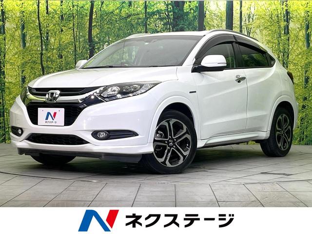 ヴェゼル(ホンダ) ハイブリッドＺ　ＳＤナビ　バックカメラ　禁煙車　ハーフレザーシート　スマートキー　オートライト　オートエアコン　純正１７インチアルミ　Ｂｌｕｅｔｏｏｔｈ　ＤＶＤ再生 中古車画像
