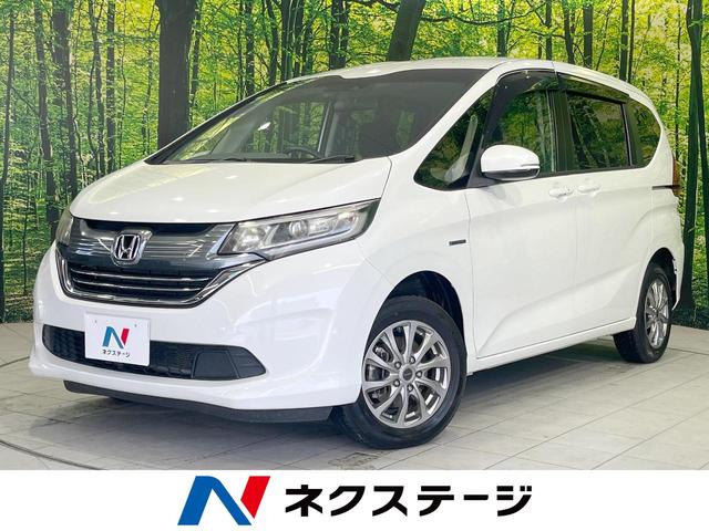 フリードハイブリッド(ホンダ) ハイブリッド・Ｇホンダセンシング　４ＷＤ　寒冷地仕様　両側電動スライド　純正７インチＳＤナビ　バックカメラ　ホンダセンシング　レーダークルーズ　禁煙車　前席シートヒーター　ドラレコ　スマートキー　ＬＥＤヘッド　ビルトインＥＴＣ 中古車画像