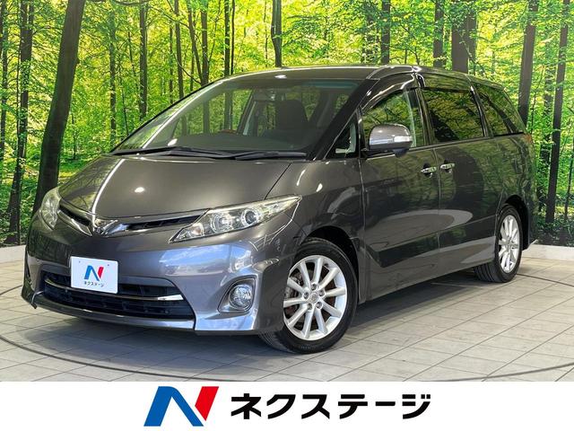 エスティマ ２．４アエラス　Ｇエディション　両側電動スライド　純正８型ナビ　後席モニター　フロント・サイド・バックカメラ　スーパーライブサウンド　ＡＣ１００Ｖ電源　禁煙車　ＥＴＣ　ドラレコ　スマートキー　ＨＩＤヘッド　オートライト（1枚目）