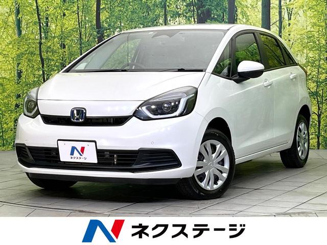 フィット ｅ：ＨＥＶベーシック　４ＷＤ　禁煙車　ＳＤナビ／Ｂｌｕｅｔｏｏｔｈ　バックカメラ　衝突軽減装置　レーダークルーズ　ドラレコ　コーナーセンサー　ＬＥＤヘッド　オートハイビーム　オートライト　車線逸脱警報（1枚目）