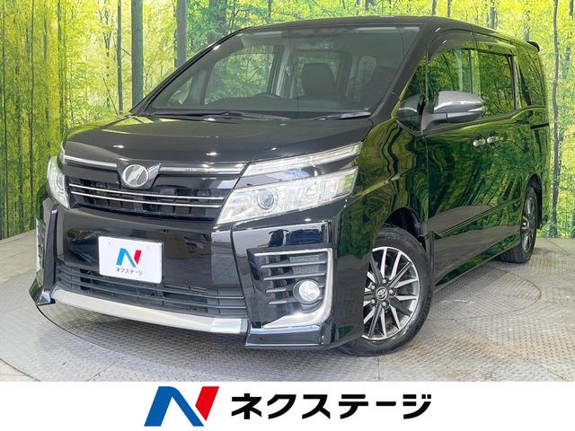 ヴォクシー ＺＳ　煌　禁煙車　両側電動スライドドア　パナソニック製ＳＤナビ　後席モニター　バックカメラ　ＥＴＣ　ドラレコ　ＬＥＤヘッドライト　純正１６インチアルミホイール　スマートキー　デュアルエアコン　革巻きステアリング（1枚目）