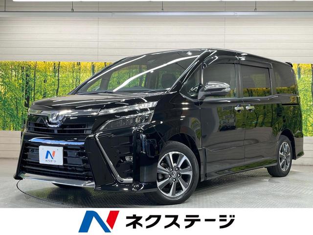 ヴォクシー ＺＳ　煌ＩＩ　純正１０型ナビ　後席モニター　バックカメラ　衝突被害軽減システム　禁煙車　コーナーセンサー　スマートキー　ＬＥＤヘッド　ビルトインＥＴＣ　クルコン　オートハイビーム　オートライト　デュアルエアコン（1枚目）