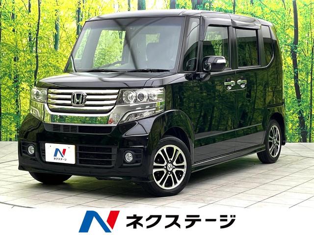 Ｎ－ＢＯＸカスタム Ｇ　ＳＳパッケージ　禁煙車　ＳＤナビ　バックカメラ　両側電動スライドドア　ＥＴＣ　ドラレコ　ＨＩＤヘッド　純正１４インチアルミ　スマートキー　オートエアコン　オートライト　電動格納ミラー　横滑り防止装置（1枚目）