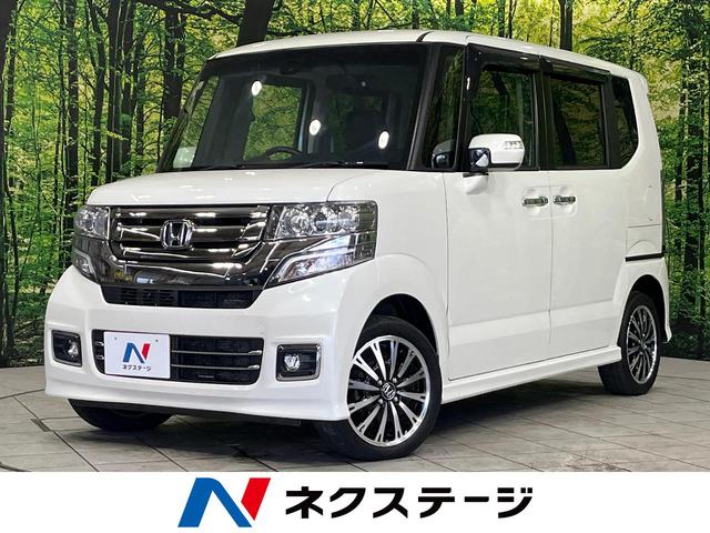 Ｎ－ＢＯＸカスタム Ｇ・ターボＬパッケージ　４ＷＤ　フルセグＳＤナビ　ターボ　両側電動ドア　バックカメラ　シティブレーキアクティブシステム　禁煙車　ハーフ合皮シート　シートヒーター　ＨＩＤヘッド　ＥＴＣ　クルコン　オートライト　オートエアコン（1枚目）