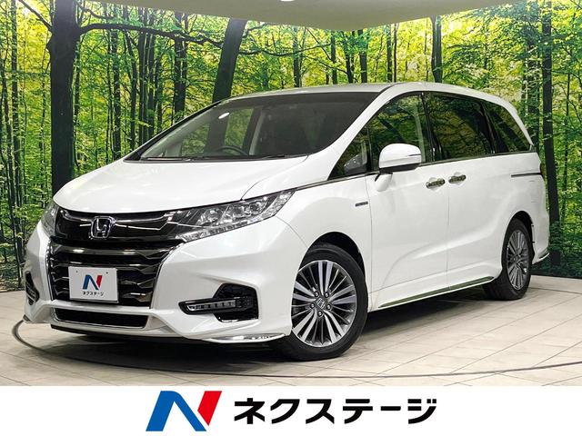 オデッセイハイブリッド ハイブリッドアブソルート・ホンダセンシング　両側電動ドア　純正ＳＤナビ　バックカメラ　衝突被害軽減システム　レーダークルーズ　禁煙車　ハーフレザーシート　パワーシート　ドラレコ　コーナーセンサー　スマートキー　ＬＥＤヘッド　ビルトインＥＴＣ（1枚目）