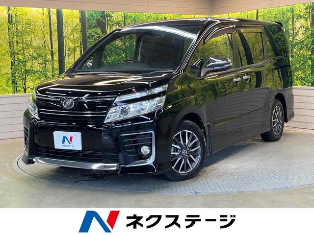 ヴォクシー ＺＳ　煌　純正９型ナビ　フリップダウン　両側電動ドア　ＬＥＤヘッド　ＥＴＣ　禁煙車　純正１６ＡＷ　リアオートエアコン　ドアバイザー　アイドリングストップ　横滑り防止　Ｂｌｕｅｔｏｏｔｈ　ＣＤ　スマートキー（1枚目）