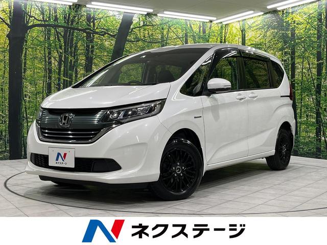 フリード＋ハイブリッド ハイブリッドＧ・ホンダセンシング　４ＷＤ　両側電動ドア　ＳＤナビ　バックカメラ　寒冷地仕様　ホンダセンシング　レーダークルーズ　禁煙車　スマートキー　ＬＥＤヘッド　シートヒーター　ＥＴＣ　車線逸脱警報　オートライト　オートエアコン（1枚目）