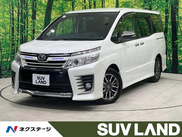 ヴォクシー ＺＳ　煌　禁煙車　後席モニター　１０型ＢＩＧＸ　フルセグ　バックカメラ　両側電動スライド　ＬＥＤヘッド　フォグランプ　純正１６インチアルミ　ＥＴＣ　アイドリングストップ　ＤＶＤ再生　オートライト　オートエアコン（1枚目）