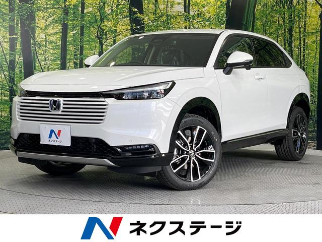 ヴェゼル ｅ：ＨＥＶ　Ｚ　登録済未使用車　純正９型ナビ　バックカメラ　衝突軽減システム　レーダークルーズ　置くだけ充電　電動リアゲート　コーナーセンサー　スマートキー　ＬＥＤヘッド　ＥＴＣ　オートハイビーム（1枚目）