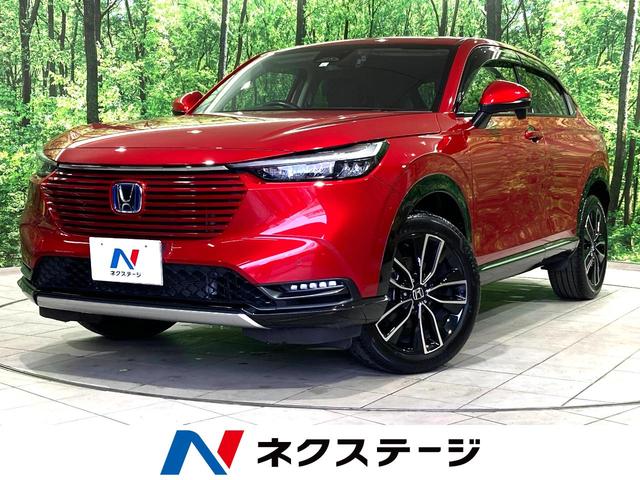 ヴェゼル ｅ：ＨＥＶ　Ｚ　禁煙車　衝突被害軽減システム　レーダークルーズ　純正９インナビックカメラ　電動リアゲート　ハーフレザーシート　コーナーセンサー　スマートキー　ＬＥＤヘッド　ＥＴＣ２．０　オートハイビーム　車線逸脱警報（1枚目）