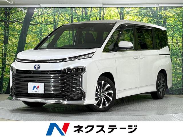 ヴォクシー ハイブリッドＳ－Ｚ　禁煙車　純正１０型ディスプレイオーディオ　全周囲カメラ　快適利便パッケージ　デジタルインナーミラー　両側電動スライドドア　衝突軽減装置　レーダークルーズ　レーンアシスト　クリアランスソナー（1枚目）