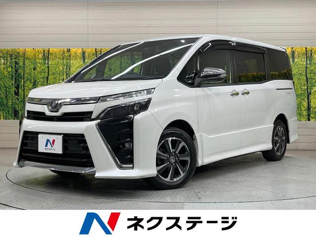 ヴォクシー ＺＳ　煌ＩＩ　純正１０型ナビ　後席モニター　両側電動スライドドア　衝突軽減装置　ＬＥＤヘッド　ドラレコ　ＥＴＣ　バックカメラ　Ｂｌｕｅｔｏｏｔｈ　フルセグＴＶ　リアオートエアコン　スマートキー　プッシュスタート（1枚目）