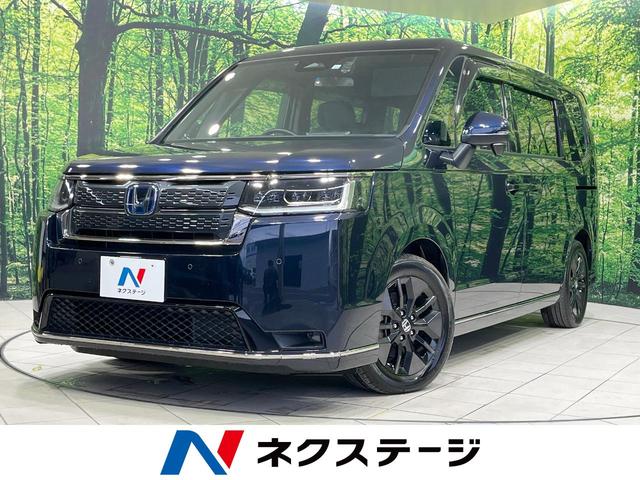 ステップワゴン e:HEVスパーダ 禁煙車 衝突軽減装置 後席モニター 純正11型ナビ 両側電動スライド バックカメラ レーダークルーズ LEDヘッド ETC ドラレコ ブラインドスポットモニター ハーフレザーシート(1枚目)
