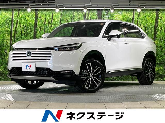 ヴェゼル ｅ：ＨＥＶ　Ｚ　登録済未使用車　純正９インチナビ　バックカメラ　ホンダセンシング　クリアランスナー　レーダークルーズコントロール　ステアリングヒーター　シートヒーター　スマートキー　パワーバックドア（1枚目）