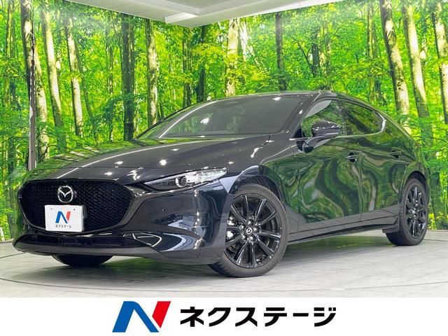 ＭＡＺＤＡ３ファストバック １５Ｓ　ブラックトーンエディション　純正ＳＤナビ　全周囲カメラ　衝突被害軽減システム　レーダークルーズ　禁煙車　ドラレコ　コーナーセンサー　スマートキー　ＬＥＤヘッド　ビルトインＥＴＣ　オートハイビーム　車線逸脱警報　オートライト（1枚目）