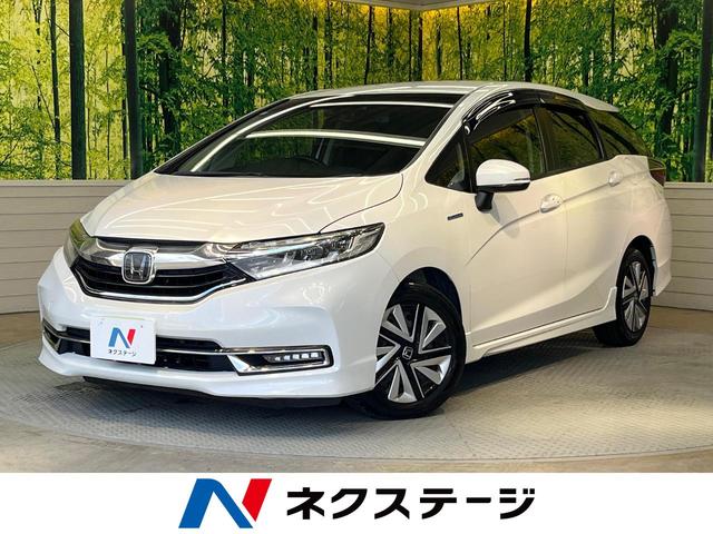 シャトル(ホンダ) ハイブリッドX ホンダセンシング 純正ナビ バックカメラ ホンダセンシング レーダークルーズ 禁煙車 ハーフレザーシート シートヒーター スマートキー LEDヘッド ETC 車線逸脱警報 誤発進抑制機能 先行車発進お知らせ機能 中古車画像