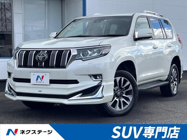 ランドクルーザープラド(トヨタ) TX Lパッケージ 4WD 7人乗り モデリスタエアロ 衝突軽減 禁煙車 純正9型ナビ 全周囲カメラ 本革シート オプション19インチアルミ レーダークルーズ ETC Bluetooth シートヒーター シートエアコン 中古車画像