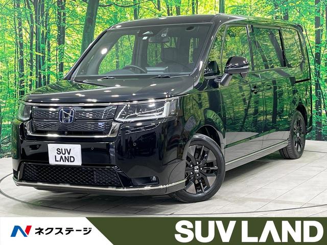 ステップワゴン(ホンダ) e:HEVスパーダ 禁煙車 後席モニター 純正11型ナビ 全周囲カメラ フルセグ 両側電動ドア ブラインドスポットモニター ホンダセンシング レーダークルーズ 電動リアゲート コーナーセンサー LEDヘッド ETC 中古車画像