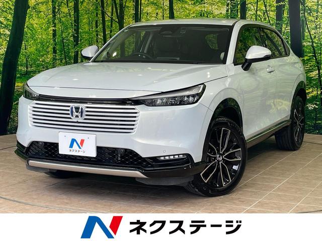 ヴェゼル(ホンダ) e:HEV Z 1年保証付 純正ナビ 全周囲カメラ 衝突被害軽減システム レーダークルーズ 禁煙車 電動リアゲート ドラレコ コーナーセンサー スマートキー LEDヘッド ETC2.0 オートハイビーム 車線逸脱警報 中古車画像