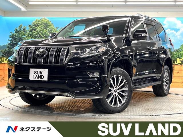 ランドクルーザープラド(トヨタ) ＴＸ　Ｌパッケージ　禁煙車　純正９インチナビ　純正エアロ　バックカメラ　シートベンチレーション　ＯＰ１９インチＡＷ　ブラック革シート　セーフティセンス　レーダークルーズ　ウッドコンビステアリング　パワーシート　ＥＴＣ 中古車画像