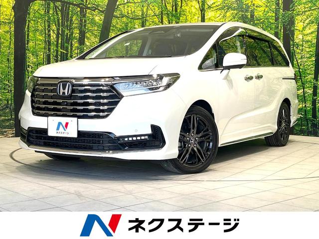 オデッセイハイブリッド e:HEVアブソルート・EX 禁煙車 両側電動ドア 純正11.4型ナビ 全周囲カメラ 衝突被害軽減システム レーダークルーズ BSM 電動リアゲート 黒レザーシート ドラレコ 前席中列シートヒーター パワーシート ビルトインETC(1枚目)