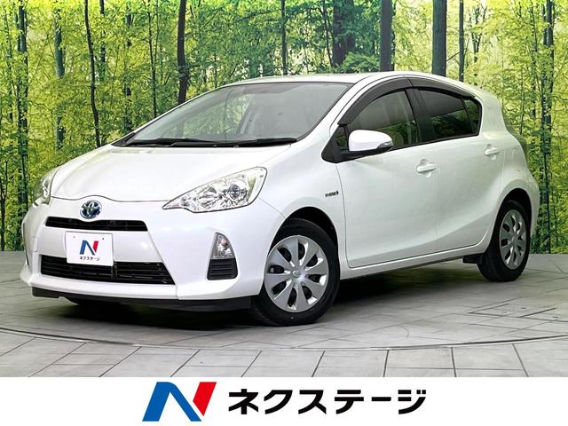 アクア(トヨタ) Ｓ　禁煙車　純正ＳＤナビ　バックカメラ　Ｂｌｕｅｔｏｏｔｈ／ＣＤ／ＤＶＤ再生　地デジ　スマートキー　前席シートヒーター　ＥＴＣ　ＬＥＤヘッド　オートライト　オートエアコン　プライバシーガラス　盗難防止装置 中古車画像