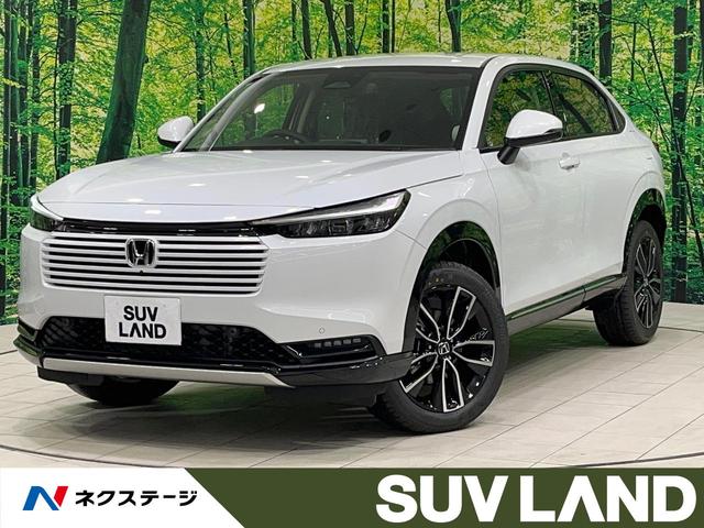 ヴェゼル(ホンダ) ｅ：ＨＥＶ　Ｚ　登録済未使用車　９型メーカーナビ　全周囲カメラ　電動リアゲート　ハーフレザーシート　コーナーセンサー　スマートキー　ＬＥＤヘッド　ＥＴＣ２．０　純正１８インチアルミ　オートハイビーム　車線逸脱警報 中古車画像