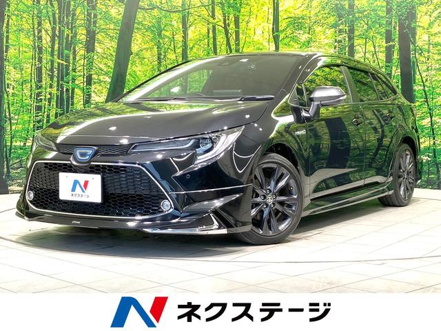 カローラツーリング(トヨタ) ハイブリッド　ダブルバイビー　禁煙車　モデリスタエアロ　純正９型ナビ　デジタルインナミラー　バックカメラ　レーダークルーズ　ＢＳＭ　ハーフレザーシート　ドラレコ　シートヒーター　ＬＥＤヘッド　ビルトインＥＴＣ　純正１７インチアルミ 中古車画像
