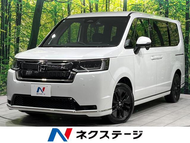 ステップワゴン(ホンダ) スパーダ　４ＷＤ　禁煙車　衝突軽減　ナビ　バックカメラ　両側電動ドア　ブラインドスポットモニター　ＥＴＣ　シートヒーター　パワーバックドア　レーダークルーズコントロール　ドラレコ　Ｂｌｕｅｔｏｏｔｈ　フルセグ 中古車画像