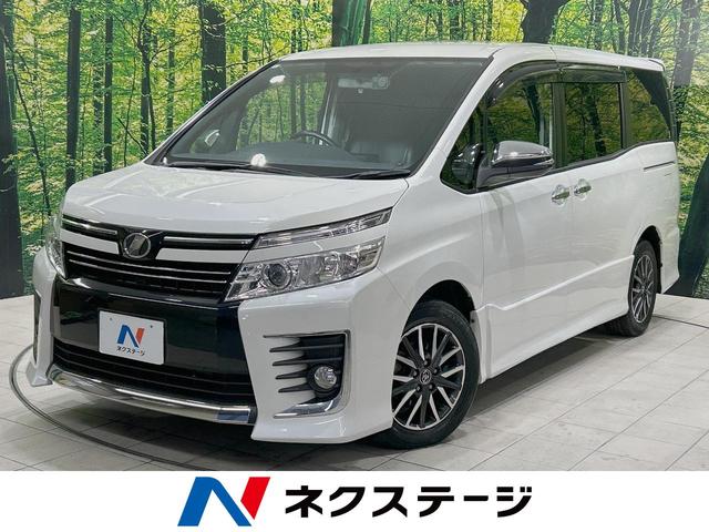 ヴォクシー(トヨタ) ＺＳ　煌　両側電動ドア　後席モニター　バックカメラ　禁煙車　ドラレコ　スマートキー　ＬＥＤヘッド　ビルトインＥＴＣ　オートライト　デュアルエアコン　Ｂｌｕｅｔｏｏｔｈ　ＣＤ　ＤＶＤ再生　フルセグ 中古車画像