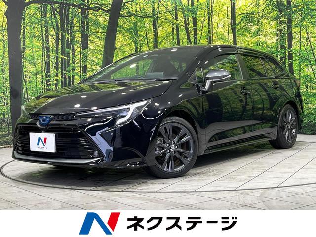 カローラツーリング(トヨタ) ハイブリッド　ダブルバイビー　４ＷＤ　禁煙車　純正１０．５インチナビ　バックカメラ　セーフティセンス　レーダークルーズ　ＥＴＣ２．０　Ｂｌｕｅｔｏｏｔｈ再生　ＬＥＤヘッド　オートハイビーム　ステアリングスイッチ 中古車画像