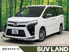 ヴォクシー ハイブリッドZS 煌 禁煙車 モデリスタエアロ 後席モニター BIG-X11型ナビ バックカメラ 両側電動ドア コーナーセンサー クルーズコントロール シートヒーター 寒冷地仕様 スマートキー LEDヘッド ETC 中古車画像